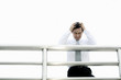 Businessman with hands on head