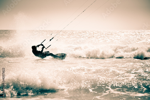 Photo: Kite surfing in waves. Kite surfing in waves.