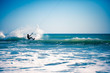 Kite surfing in waves.