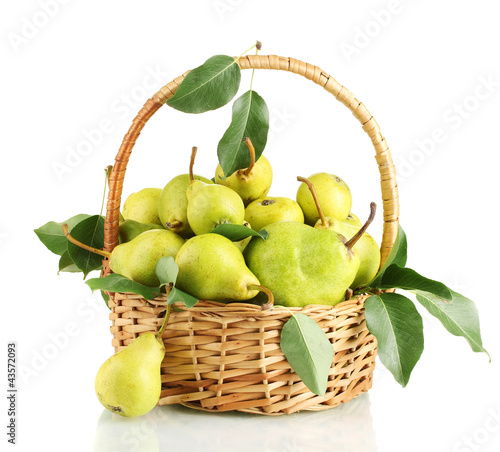 Photo: Juicy flavorful pears in basket isolated on white Juicy flavorful pears in basket isolated on white