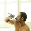 A man drinking water after working out