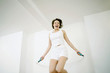 Woman playing with skipping rope