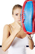 Woman training with punching bag