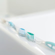 Two toothbrushes on the sink