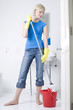 Woman mopping the bathroom floor