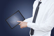 businessman pushing tablet screen in hand..