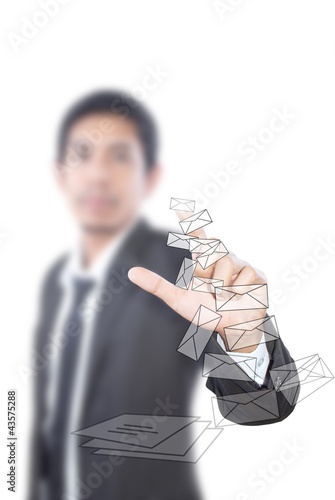 Photo: Businessman pushing mail for social network. Businessman pushing mail for social network.