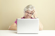 Senior using laptop