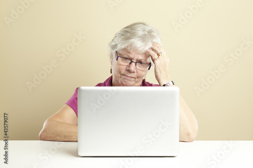 Photo: Senior using laptop Senior using laptop