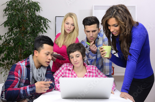Photo: young diverse team of students or employees young diverse team of students or employees