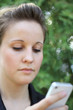 Young Attractive Businesswoman Texting On the Phone