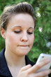 Young Attractive Businesswoman Texting On the Phone