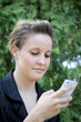 Young Attractive Businesswoman Texting On the Phone