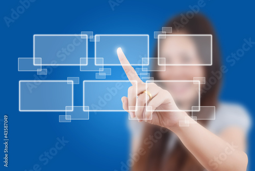 Photo: Business lady pushing button on the whiteboard. Business lady pushing button on the whiteboard.