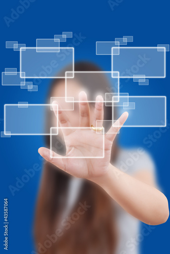 Photo: Business lady pushing button on the whiteboard. Business lady pushing button on the whiteboard.