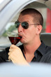 Man Driving While Drinking Alcohol