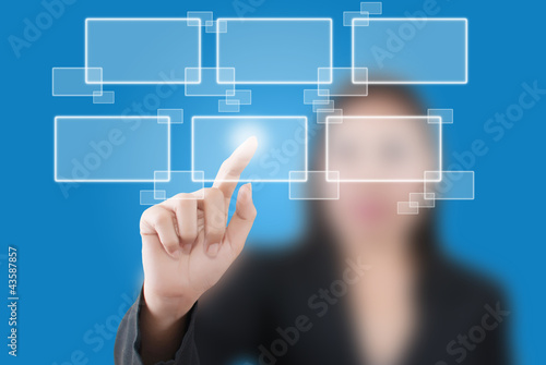 Photo: Business lady pushing button on the whiteboard. Business lady pushing button on the whiteboard.