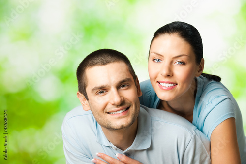 Photo: Portrait of happy couple, outdoors Portrait of happy couple, outdoors