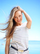 Young attractive woman near the ocean on a summer day