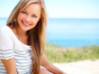 Young attractive woman near the ocean on a summer day