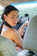 Woman driver looking back