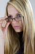 Nearsighted Beauty Looks Over Her Glasses