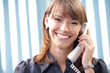 Young business woman with phone at office