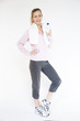 Attractive healthy young woman in gym clothes