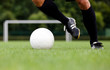Detailed view of a footballer / soccer player dribbling the ball