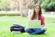 Photo: Hispanic college student with laptop Hispanic college student with laptop