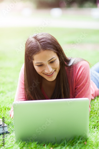 Photo: Hispanic college student with laptop Hispanic college student with laptop