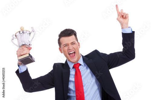 Foto: victory roar of a young businss man victory roar of a young businss man