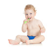 Happy baby child brushing teeth