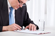 Senior businessman checking contract