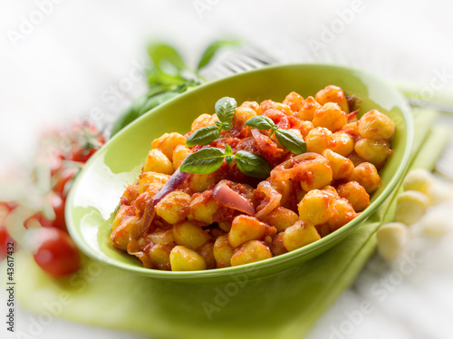 Photo: homemade gnocchi with tomato sauce, selective focus homemade gnocchi with tomato sauce, selective focus