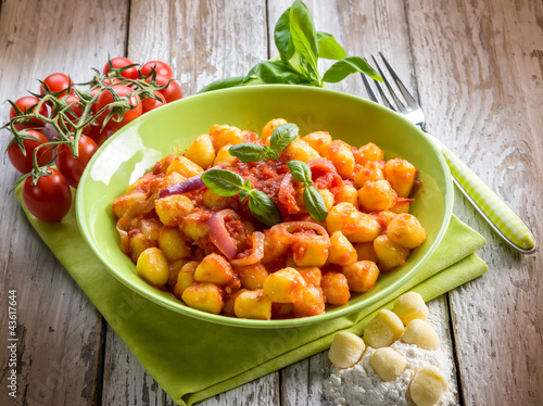 Photo: homemade gnocchi with tomato sauce basil and onions homemade gnocchi with tomato sauce basil and onions