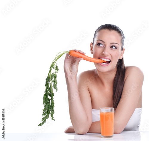 Photo: Woman with the carrots juice Woman with the carrots juice