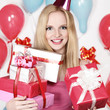 Photo: Sexy young blonde girl holding a gift Sexy young blonde girl holding a gift