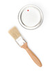 Paintbrush is near cover, isolated on white