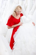 Future bride chooses an appropriate wedding gown