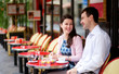Happy couple in a Parisian outdoor cafe