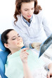 The patient is curious about the x ray photo of her teeth