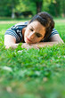 Young woman relaxing and listening to music outdoors