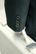 A close-up picture of a hand carrying a briefcase