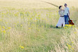 A couple walking together on the prairie