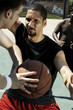 A man stopping his opponent from passing the ball