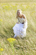 A woman standing alone on the prairie