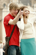 A guy showing something to his girlfriend