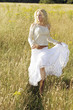 A woman running happily on the prairie