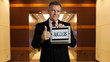 businessman holds tablet that says success